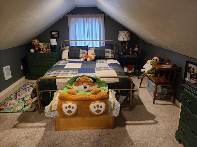 bedroom featuring carpet, a textured ceiling, and lofted ceiling