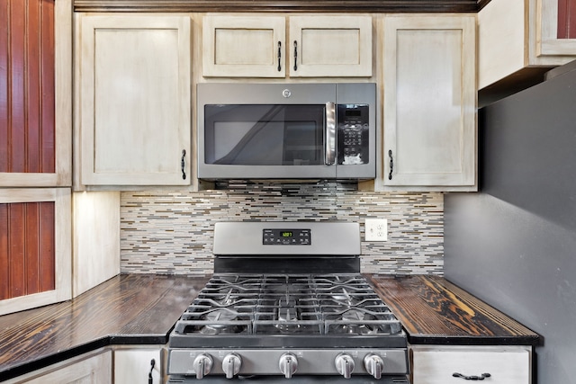 5608 Trinity Way, Florence, MT 59833 - kitchen featuring backsplash, appliances with stainless steel finishes, and butcher block counters