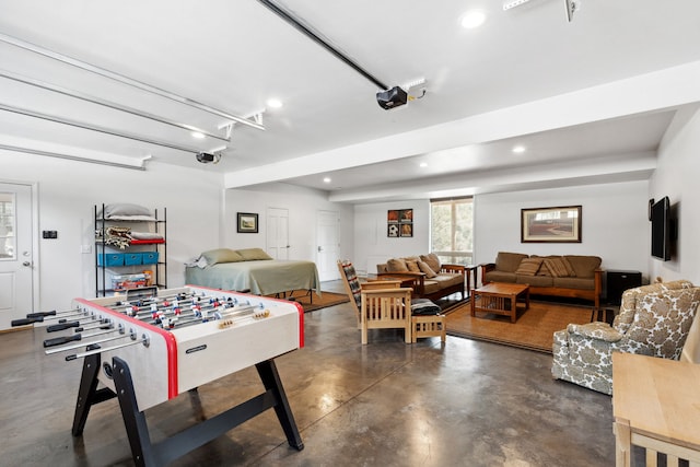 5608 Trinity Way, Florence, MT 59833 - game room featuring a garage, concrete flooring, and recessed lighting