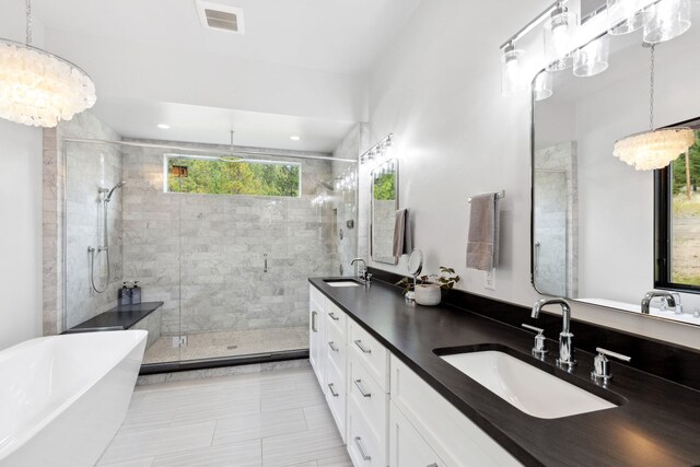 5608 Trinity Way, Florence, MT 59833 - full bathroom with a soaking tub, a sink, double vanity, and a stall shower