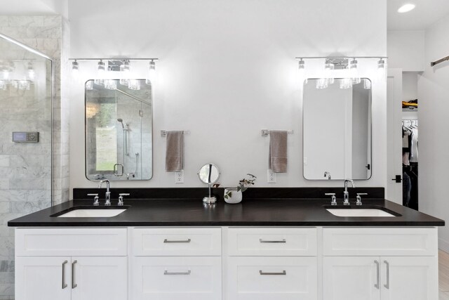 5608 Trinity Way, Florence, MT 59833 - full bathroom featuring a sink, double vanity, and a stall shower