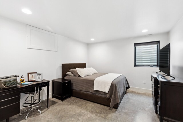 5608 Trinity Way, Florence, MT 59833 - bedroom featuring baseboards, concrete flooring, and recessed lighting
