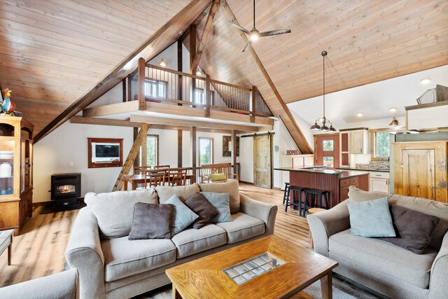 5608 Trinity Way, Florence, MT 59833 - living room featuring light wood finished floors, wooden ceiling, and a healthy amount of sunlight