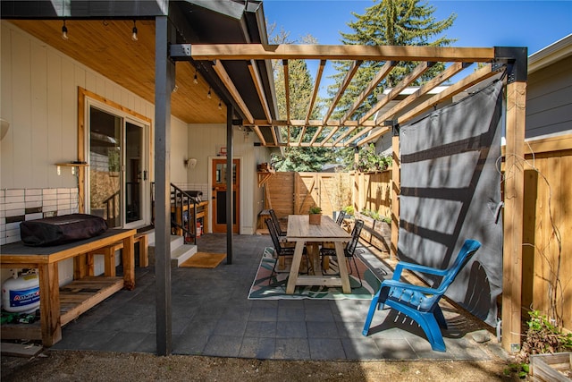 4210 Lincoln Rd, Missoula, MT 59802 - view of patio with outdoor dining area, fence, and entry steps