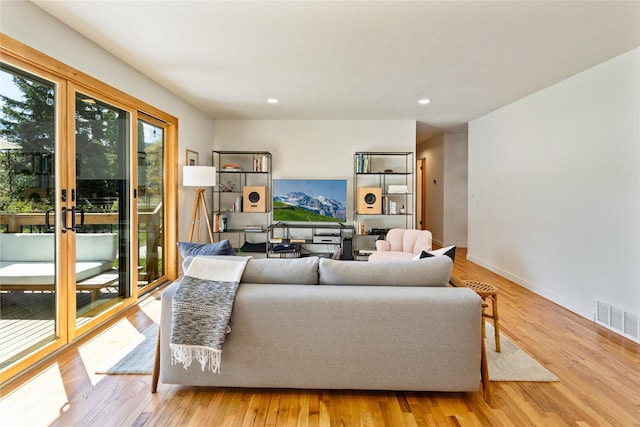 4210 Lincoln Rd, Missoula, MT 59802 - living room with plenty of natural light, visible vents, wood finished floors, and recessed lighting