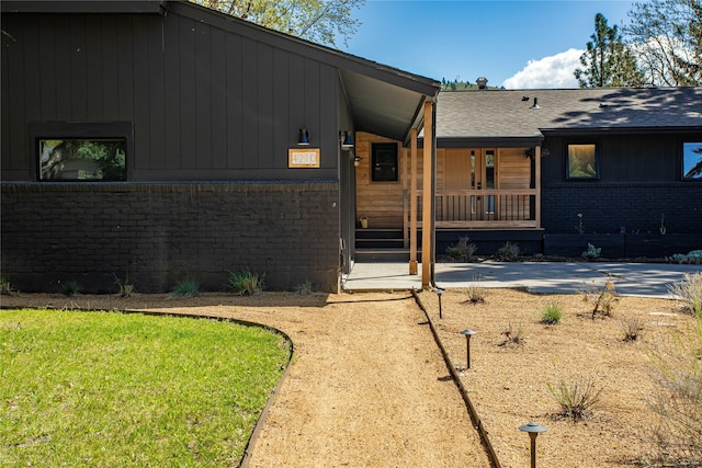 4210 Lincoln Rd, Missoula, MT 59802 - view of front of property with covered porch and brick siding