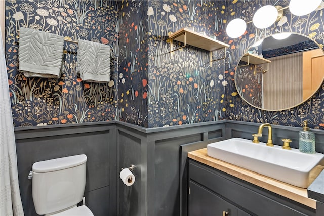 4210 Lincoln Rd, Missoula, MT 59802 - bathroom featuring toilet, a wainscoted wall, and wallpapered walls