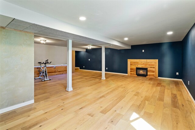 4210 Lincoln Rd, Missoula, MT 59802 - finished below grade area featuring baseboards, recessed lighting, light wood-type flooring, and a lit fireplace