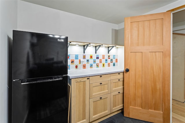 4210 Lincoln Rd, Missoula, MT 59802 - kitchen with freestanding refrigerator, light countertops, backsplash, and light brown cabinetry