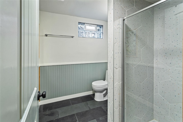4210 Lincoln Rd, Missoula, MT 59802 - bathroom featuring tile patterned floors, a wainscoted wall, toilet, and a stall shower