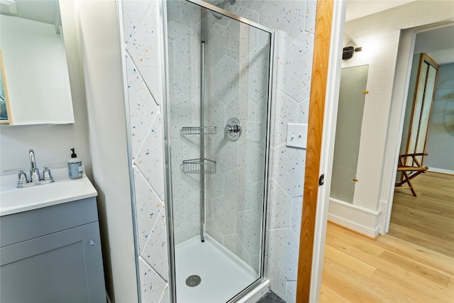 4210 Lincoln Rd, Missoula, MT 59802 - bathroom featuring vanity, wood finished floors, and a stall shower