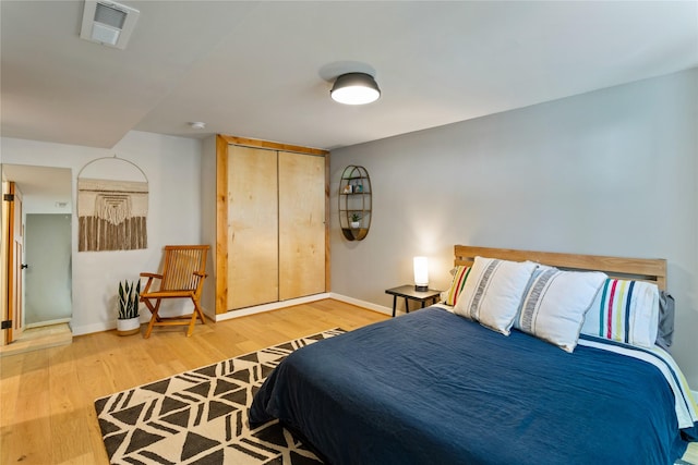 4210 Lincoln Rd, Missoula, MT 59802 - bedroom featuring a closet, visible vents, wood finished floors, and baseboards