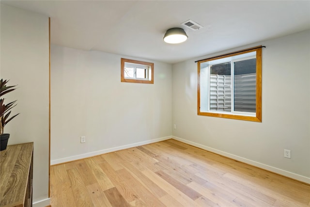 4210 Lincoln Rd, Missoula, MT 59802 - spare room with visible vents, wood finished floors, and baseboards