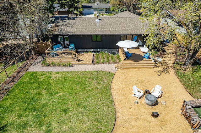 4210 Lincoln Rd, Missoula, MT 59802 - rear view of house featuring a fenced backyard, roof with shingles, a wooden deck, and french doors