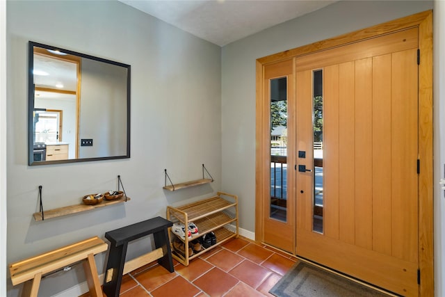 4210 Lincoln Rd, Missoula, MT 59802 - foyer with a wealth of natural light, dark tile patterned flooring, and baseboards