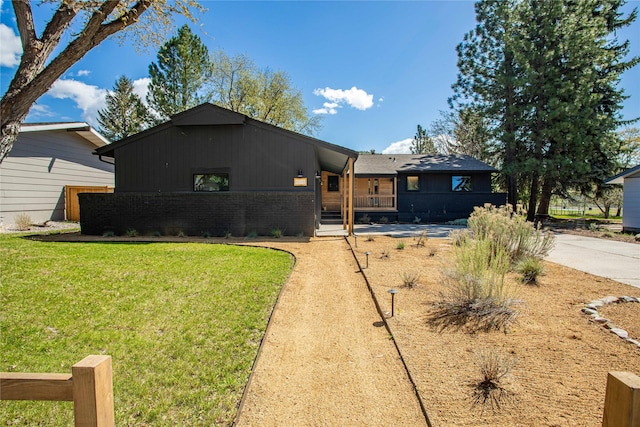 4210 Lincoln Rd, Missoula, MT 59802 - view of front of house featuring a front yard and brick siding