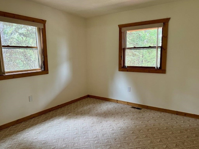 1180 Grandview Dr, Seeley Lake, MT 59868 - carpeted empty room with healthy amount of natural light
