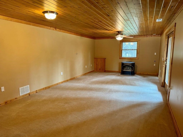 1180 Grandview Dr, Seeley Lake, MT 59868 - unfurnished living room featuring wood ceiling, a wood stove, light colored carpet, and ceiling fan