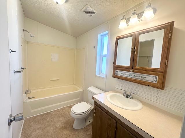 bathroom with tasteful backsplash, shower / bathing tub combination, vanity, toilet, and visible vents