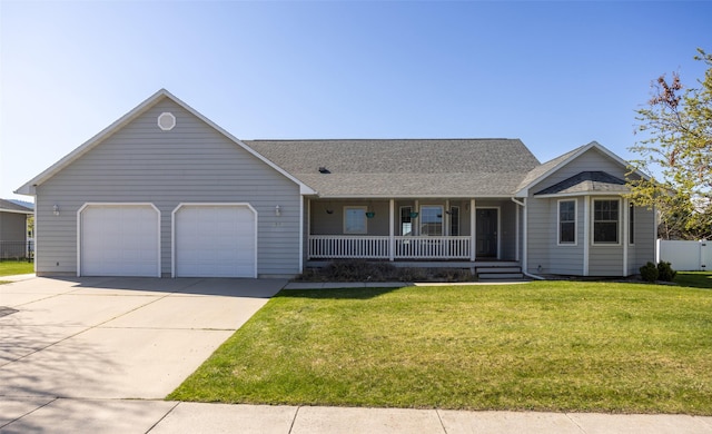 4891 Christian Dr, Missoula, MT 59803 - ranch-style home featuring driveway, covered porch, fence, a front yard, and a garage