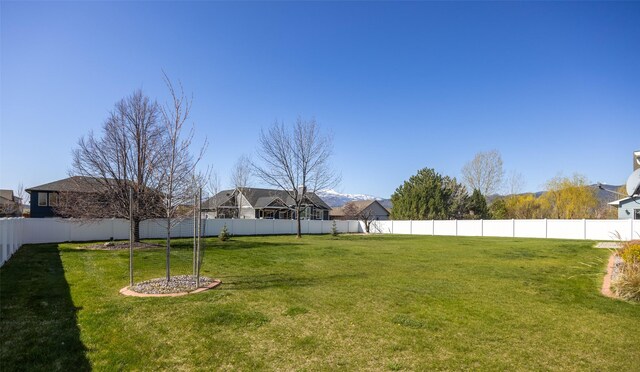 4891 Christian Dr, Missoula, MT 59803 - additional living space with light wood-style floors, lofted ceiling, visible vents, and baseboards
