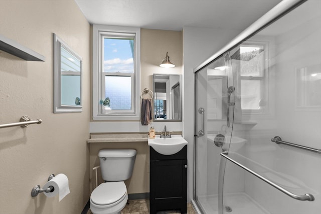 360 White House Ln, Bonner, MT 59823 - bathroom featuring a stall shower, vanity, and toilet