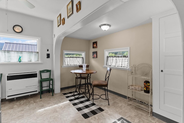 360 White House Ln, Bonner, MT 59823 - dining area with arched walkways, heating unit, and ceiling fan
