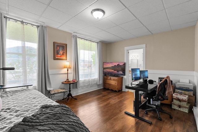360 White House Ln, Bonner, MT 59823 - bedroom featuring dark wood finished floors, a drop ceiling, an office area, and wainscoting