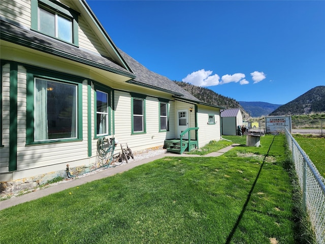 360 White House Ln, Bonner, MT 59823 - back of property with a mountain view and roof with shingles