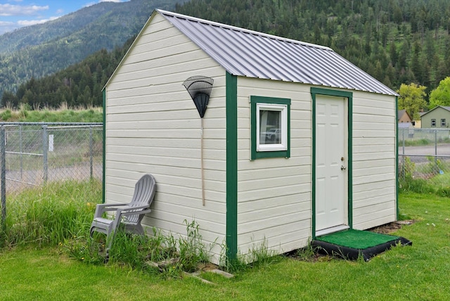 360 White House Ln, Bonner, MT 59823 - view of shed featuring a wooded view and a mountain view
