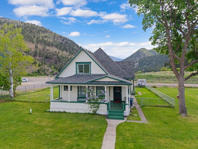 360 White House Ln, Bonner, MT 59823 - view of front of house featuring covered porch, a mountain view, and a shingled roof