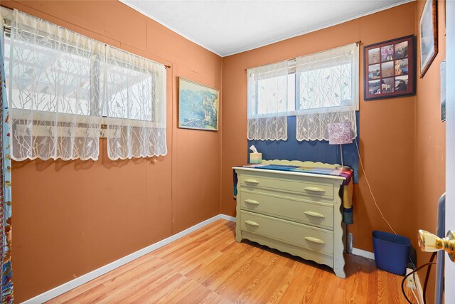 bathroom with wood finished floors, a sink, and toilet