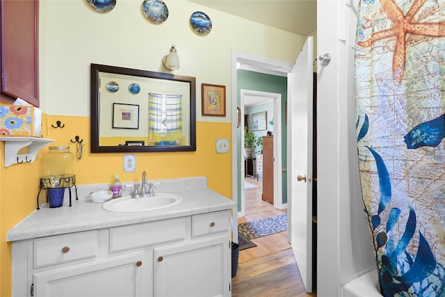 below grade area with freestanding refrigerator, washing machine and clothes dryer, and concrete block wall