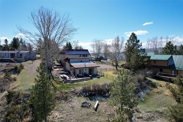 exterior space with dirt driveway, a front lawn, a shed, an outdoor structure, and a garage