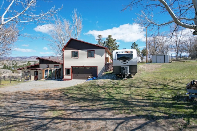 view of front of house with stucco siding, fence, and an attached carport