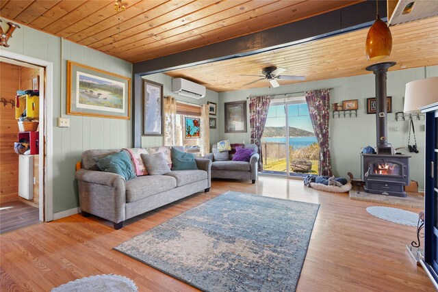 living room with wooden ceiling, wood finished floors, and stairway