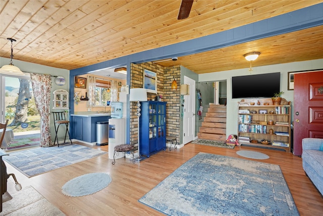 kitchen with light countertops, a sink, blue cabinetry, and appliances with stainless steel finishes