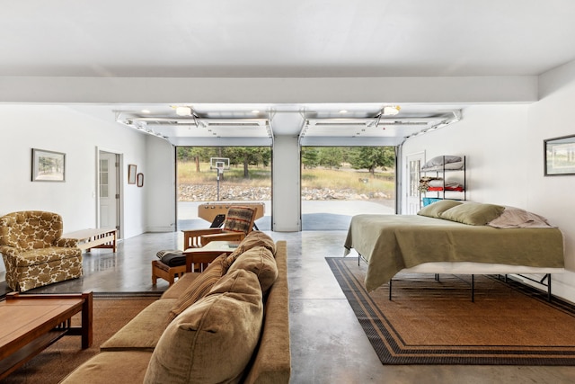 interior space with a wealth of natural light, track lighting, and concrete floors