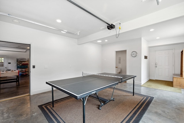 rec room with a garage, baseboards, concrete floors, and recessed lighting