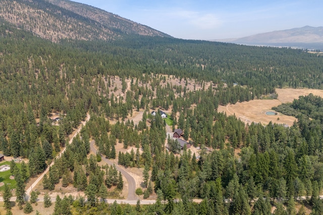 aerial view with a forest view and a mountain view