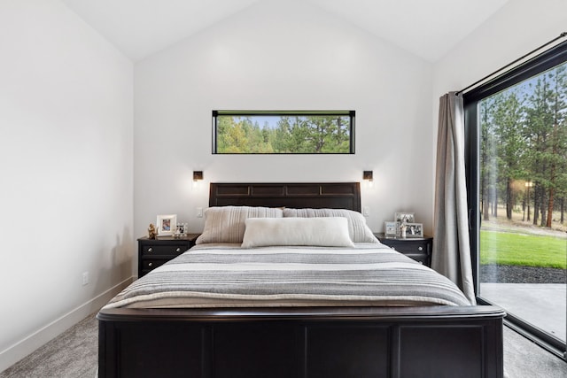 bedroom with vaulted ceiling, carpet floors, baseboards, and access to outside