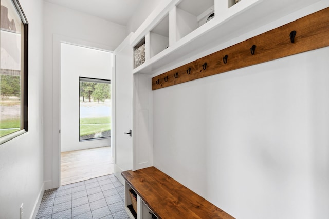 mudroom with light tile patterned floors