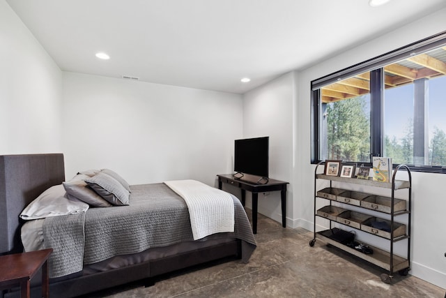 bedroom featuring baseboards, concrete floors, visible vents, and recessed lighting