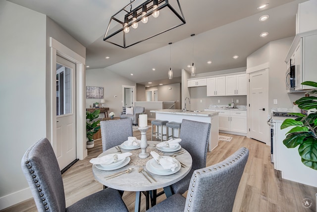 215 Meadow View Loop, East Helena, MT 59635 - dining room with recessed lighting, light wood-style flooring, lofted ceiling, and a notable chandelier