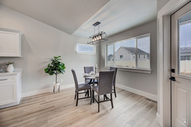 215 Meadow View Loop, East Helena, MT 59635 - dining area with light wood-type flooring, baseboards, a chandelier, and visible vents