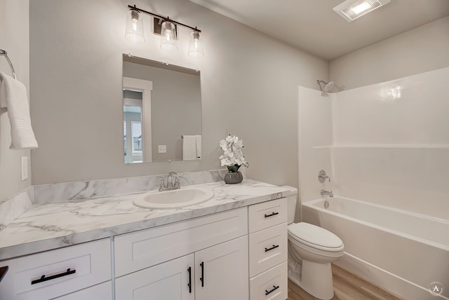 215 Meadow View Loop, East Helena, MT 59635 - bathroom featuring toilet, visible vents, shower / washtub combination, wood finished floors, and vanity