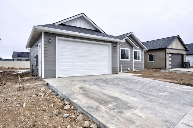 215 Meadow View Loop, East Helena, MT 59635 - ranch-style home with board and batten siding, driveway, and a garage
