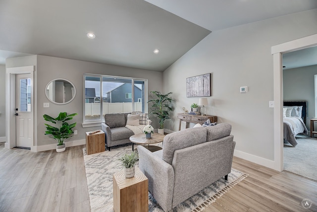 215 Meadow View Loop, East Helena, MT 59635 - living room featuring vaulted ceiling, baseboards, recessed lighting, and light wood-style flooring