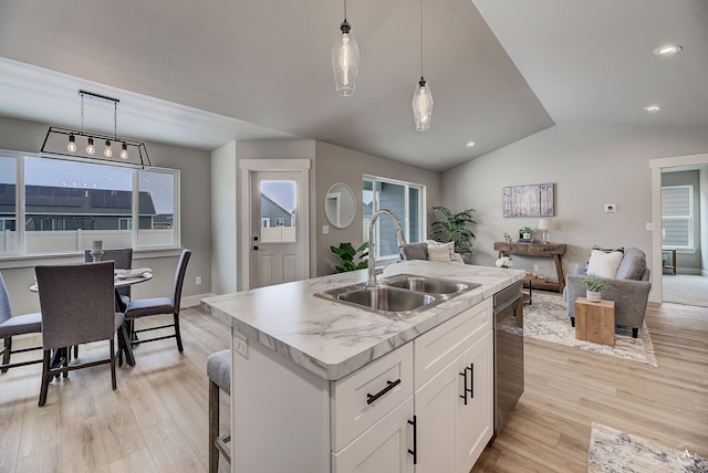 215 Meadow View Loop, East Helena, MT 59635 - kitchen featuring a healthy amount of sunlight, open floor plan, stainless steel dishwasher, and a sink