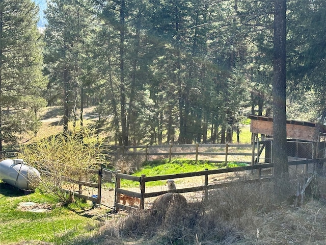 11 High Country Ct, Plains, MT 59859 - view of yard with fence and a view of trees